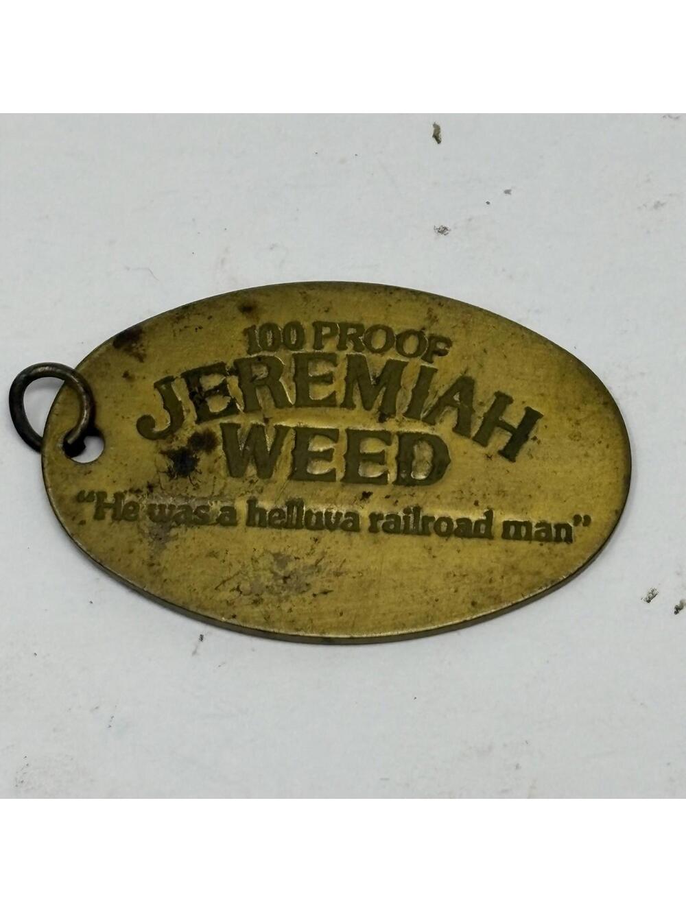 Vintage Jeremiah Weed 100 Proof Bourbon Liqueur Metal Keychain Tag Heublein Inc.